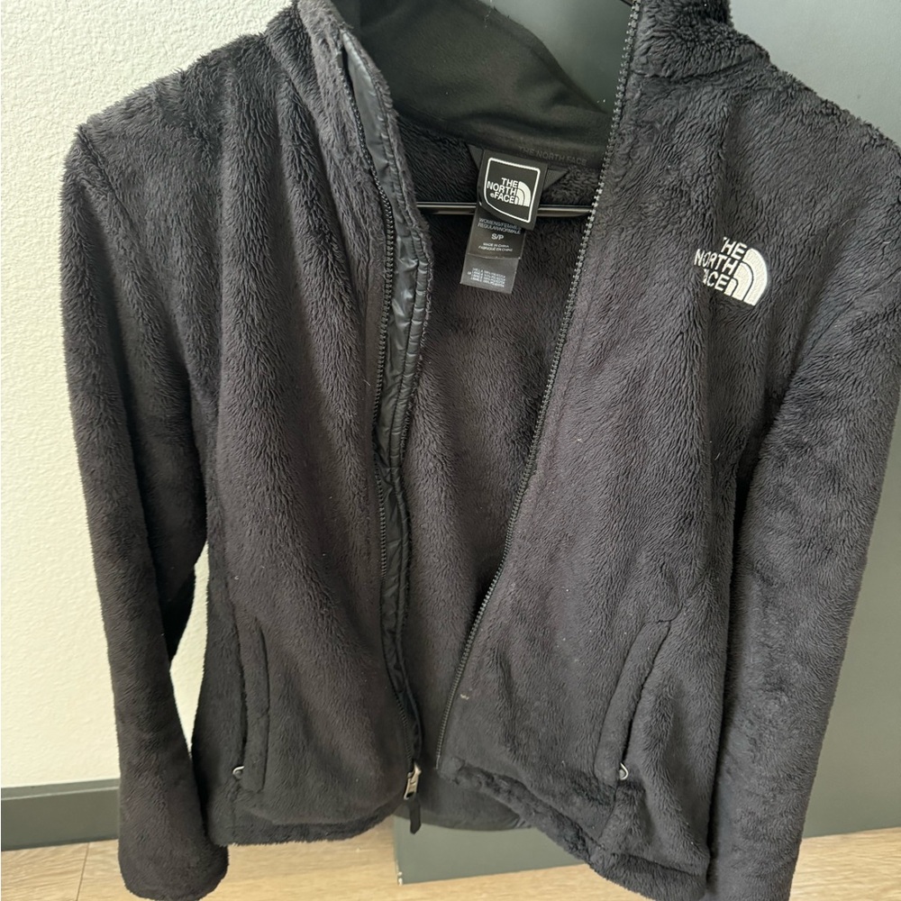 Black fuzzy north face jacket